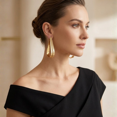 Gold Fluid Loop Earrings With Textured Open Frame