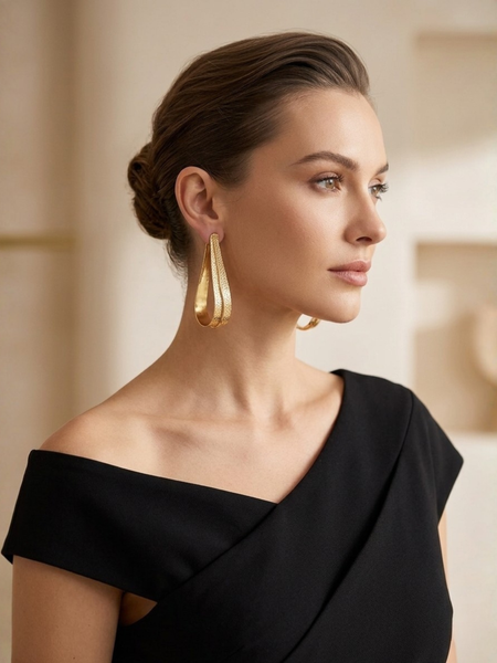 Gold Fluid Loop Earrings With Textured Open Frame