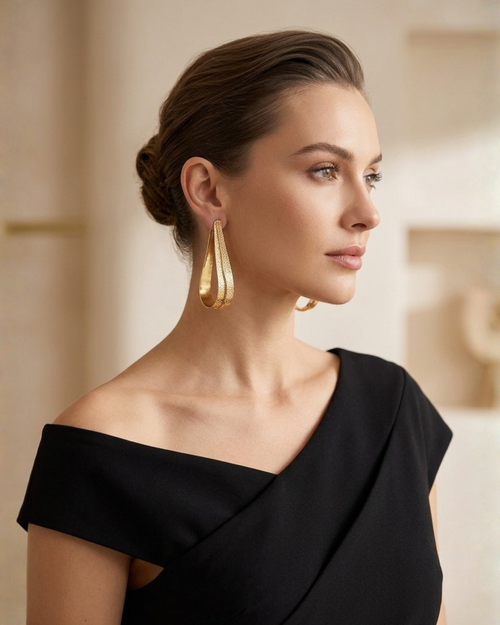 Gold Fluid Loop Earrings With Textured Open Frame
