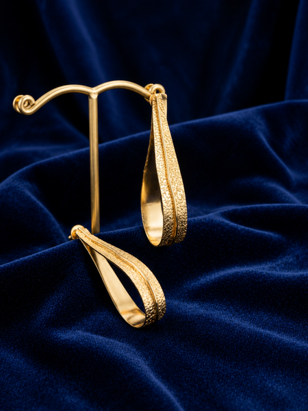 Gold Fluid Loop Earrings With Textured Open Frame